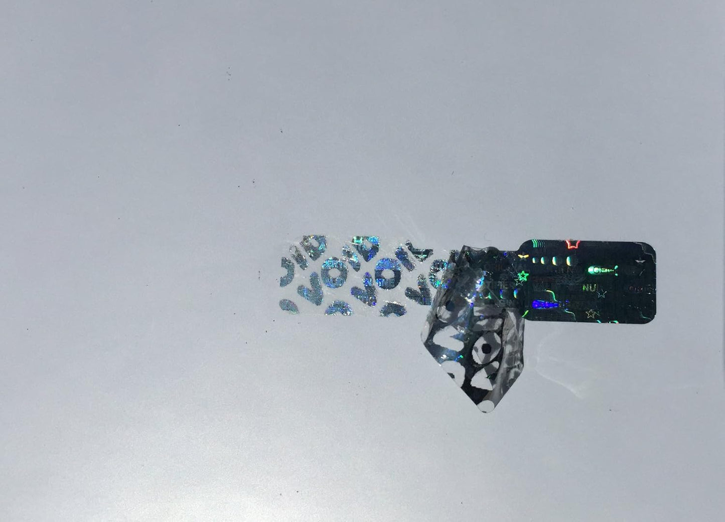 2,000 Silver Dog Bone Hologram Sticker TamperMax Tamper Evident Security Label Holographic Seal Sticker, Size 1.75" x 0.375" (44mm x 9mm).